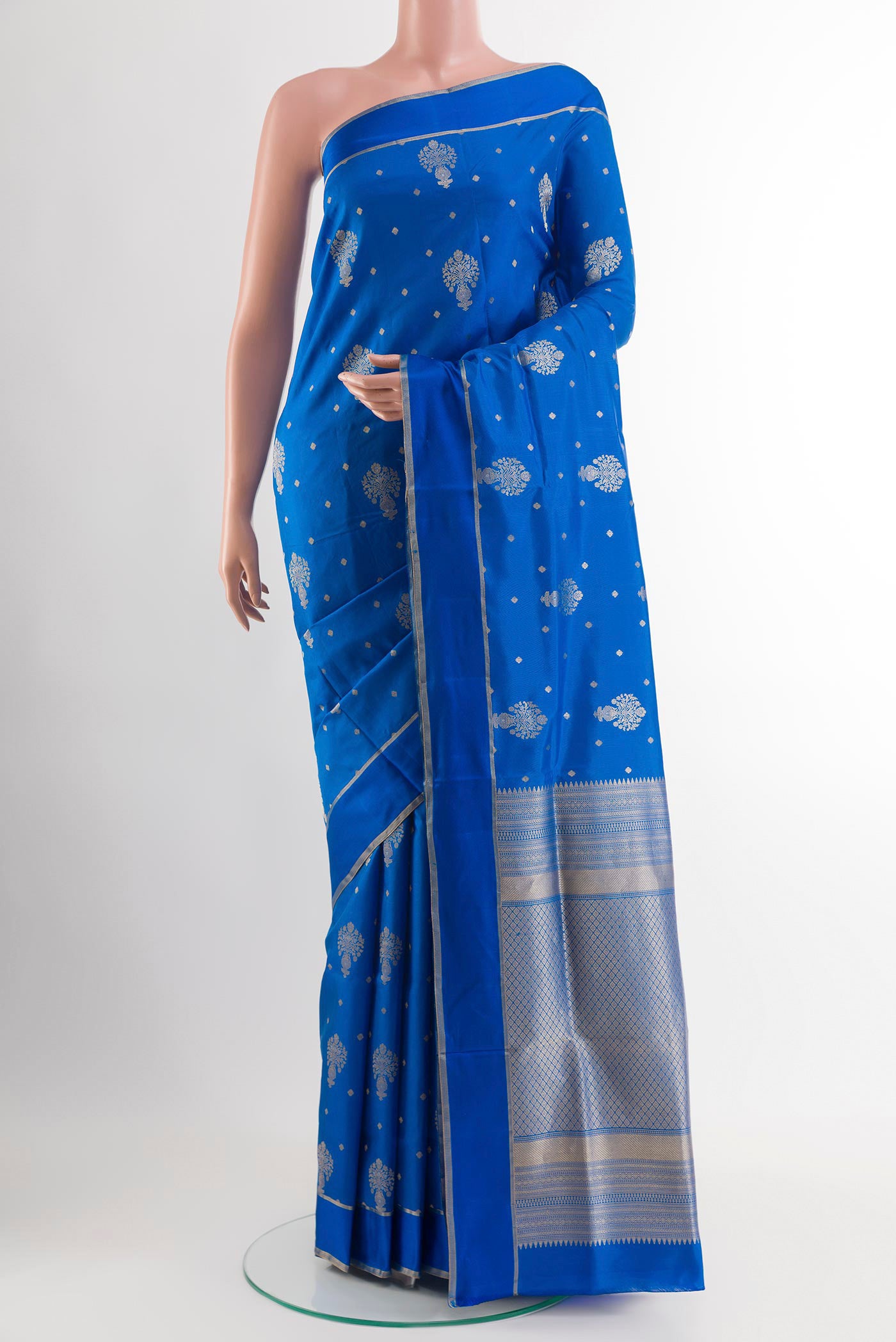 Blue Soft Silk Saree with Zari Butta on the body and Zari Border.  displayed on a mannequin