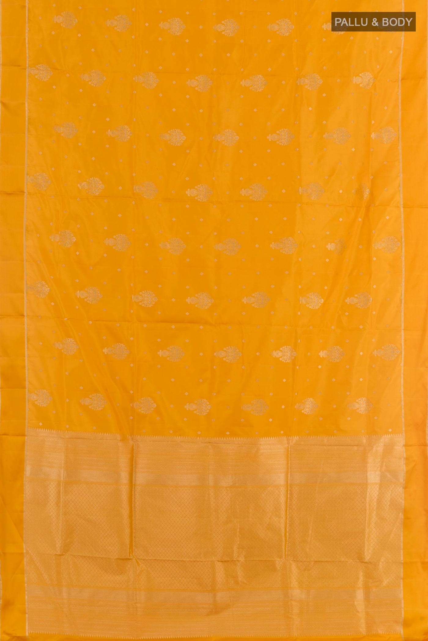 Flat view of Yellow Soft Silk Saree with Zari Butta on the body and Zari Border. 