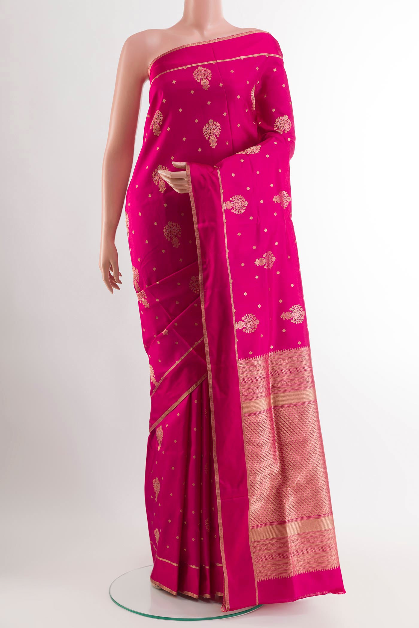 Pink Soft Silk Saree with Zari Butta on the body and Zari Border.  displayed on a mannequin