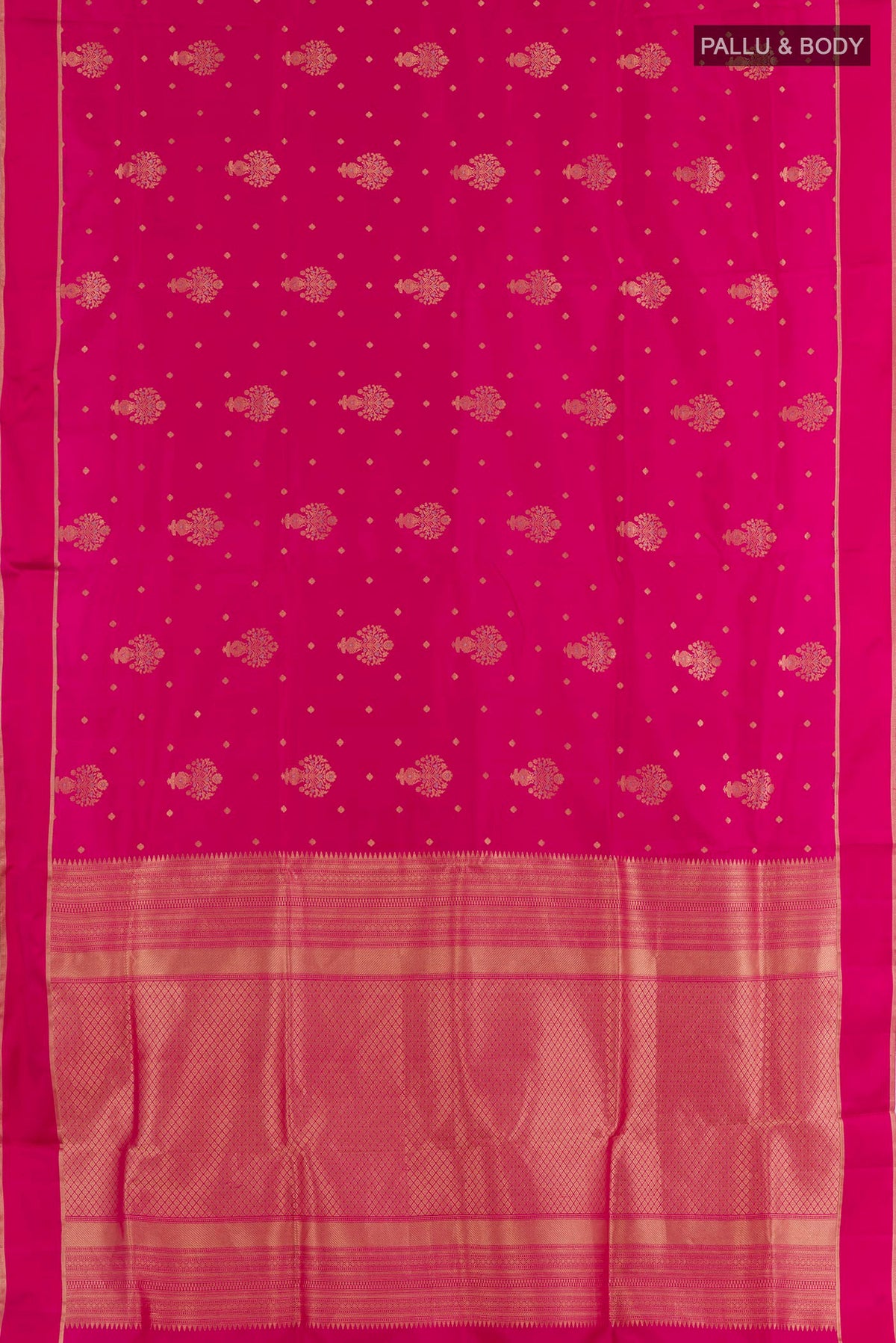 Flat view of Pink Soft Silk Saree with Zari Butta on the body and Zari Border. 
