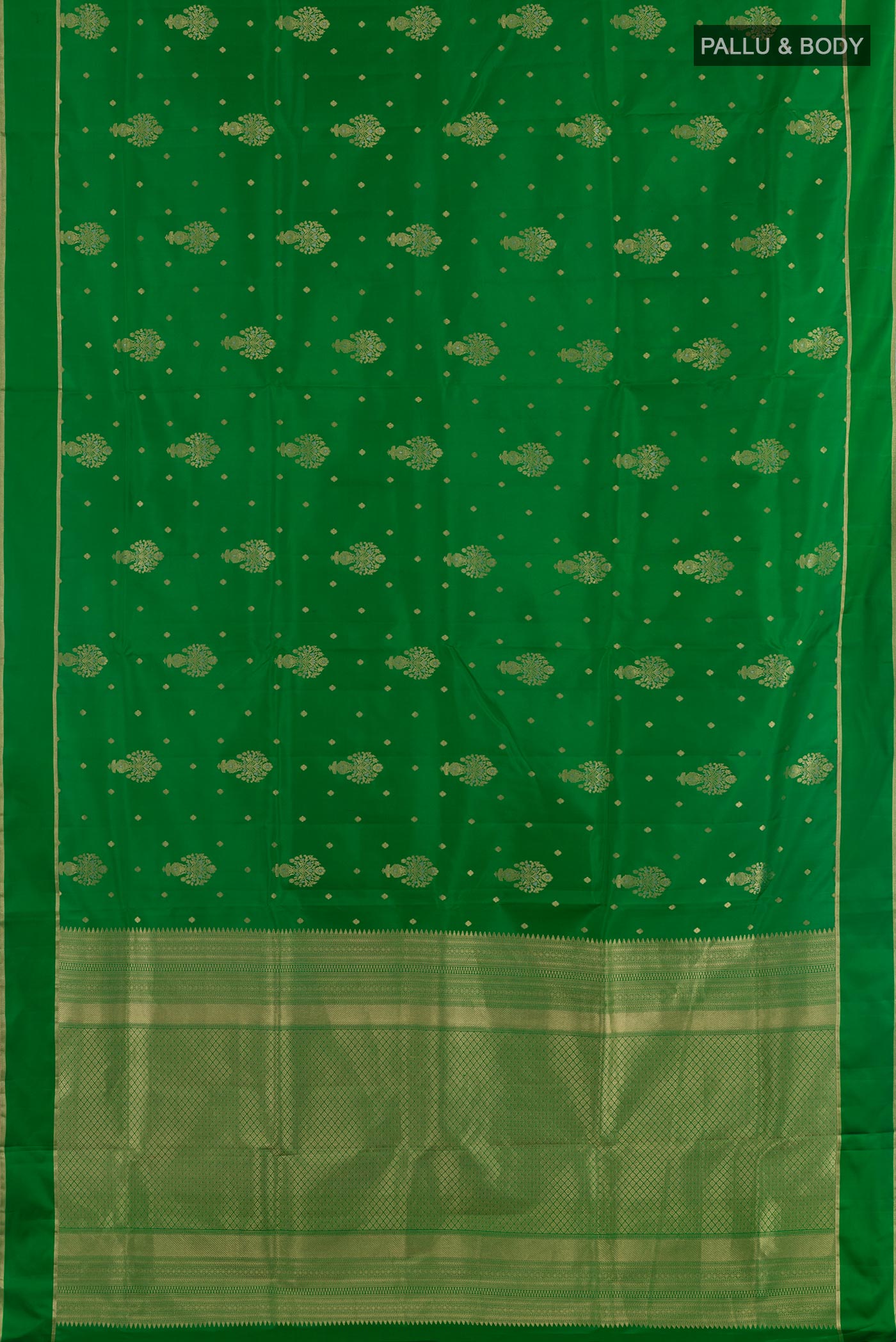 Flat view of Green Soft Silk Saree with Zari Butta on the body and Zari Border. 