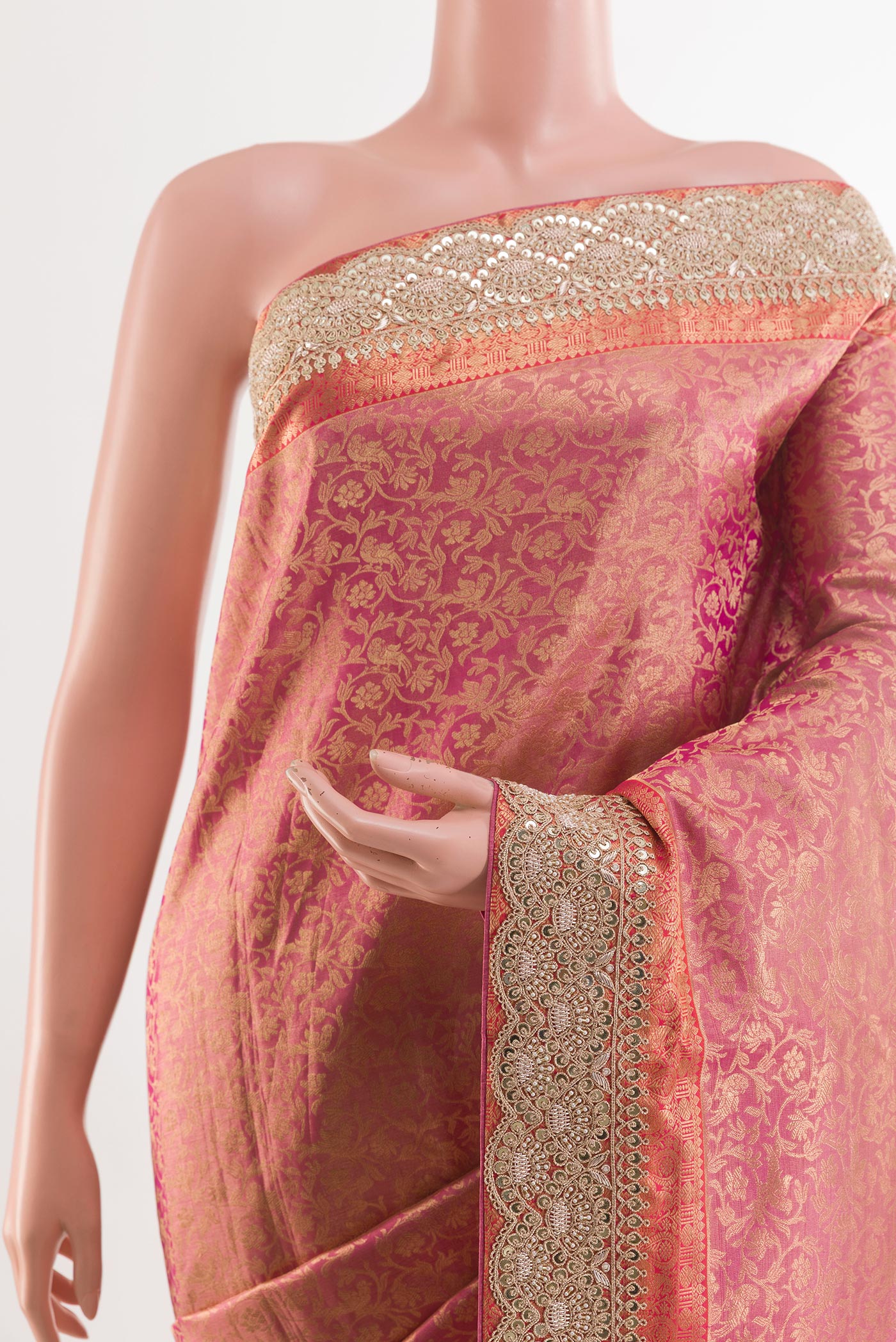 Border image of Pink Tissue Silk Saree with Zari Brocade on the body and Embroidery Border. 