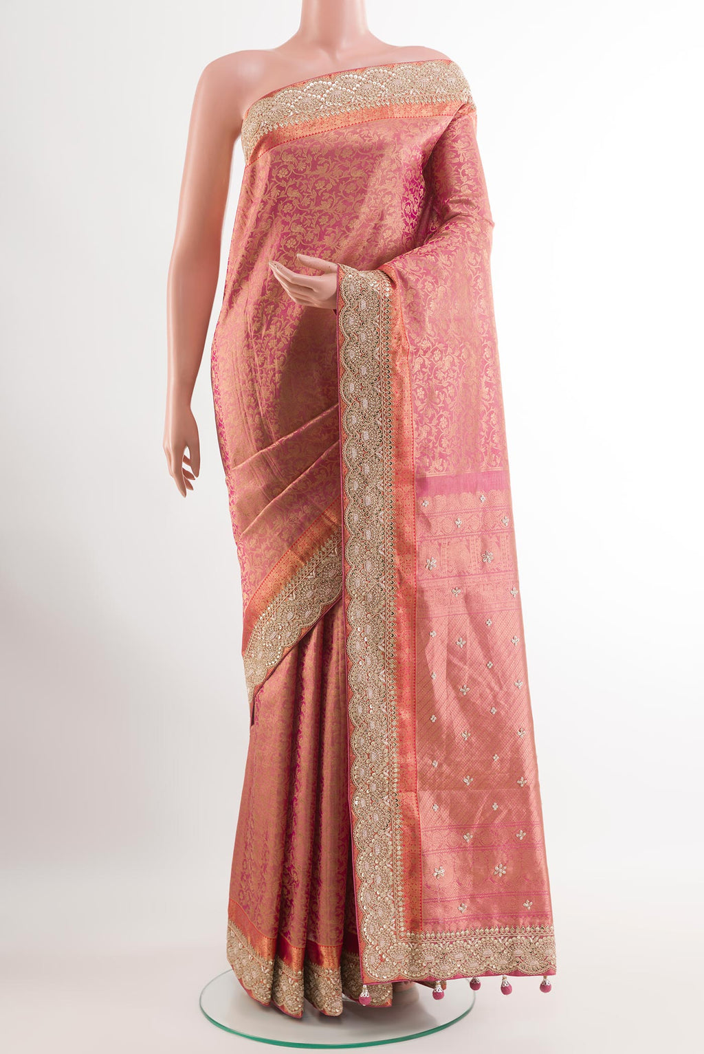 Pink Tissue Silk Saree with Zari Brocade on the body and Embroidery Border.  displayed on a mannequin