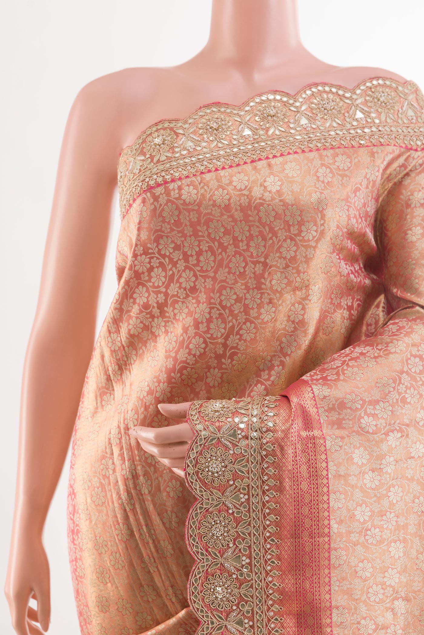 Border image of Rose Gold Tissue Silk Saree with Zari Brocade on the body and Embroidery Border. 