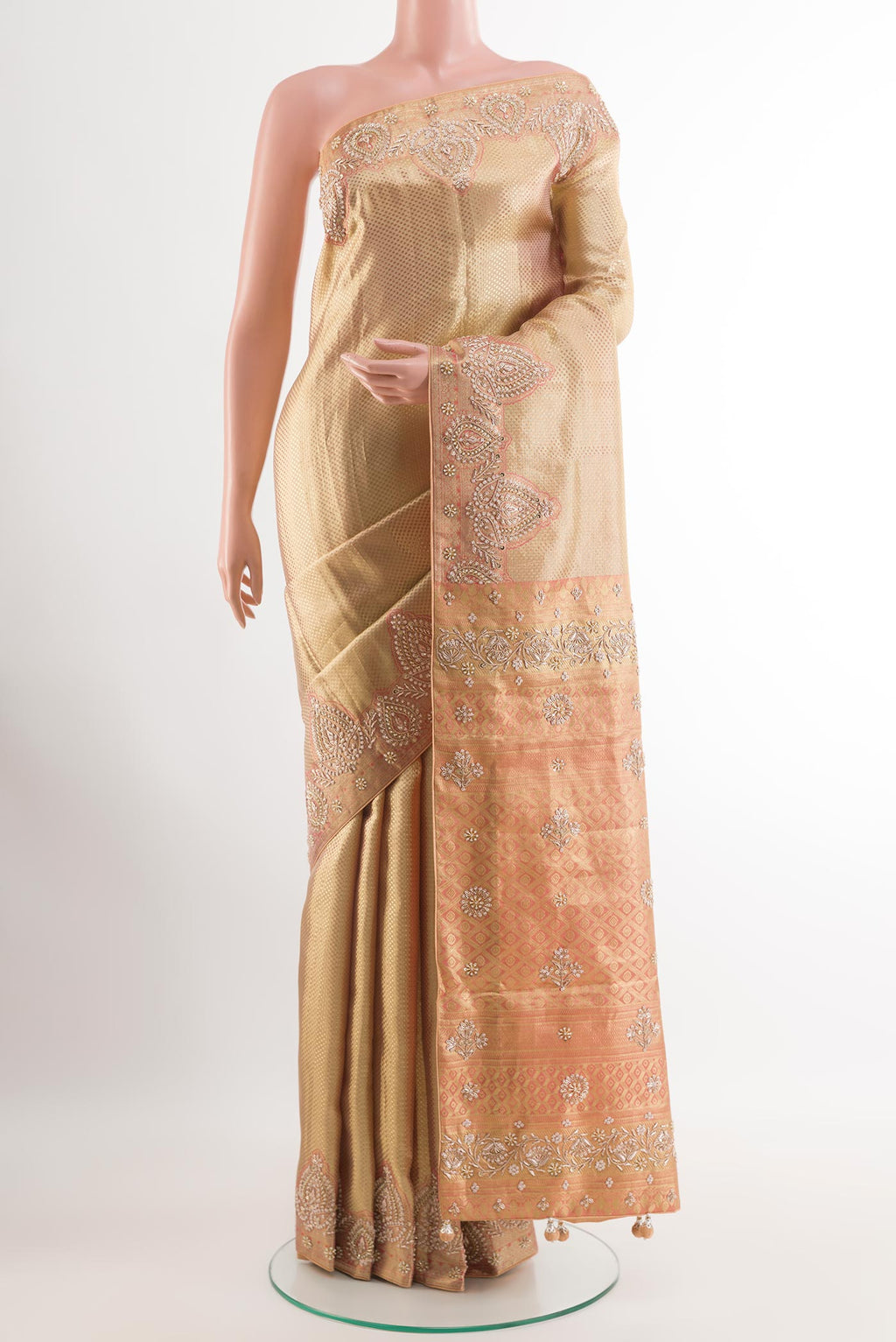 Golden Tissue Silk Saree with Zari Brocade on the body and Embroidery Border.  displayed on a mannequin