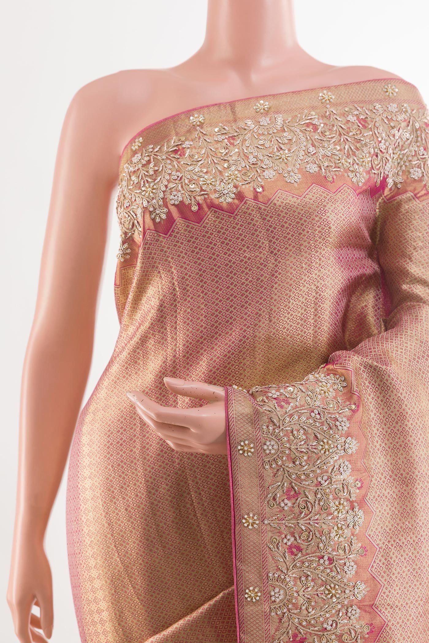 Border image of Rose Gold Tissue Silk Saree with Zari Brocade on the body and Embroidery Border. 