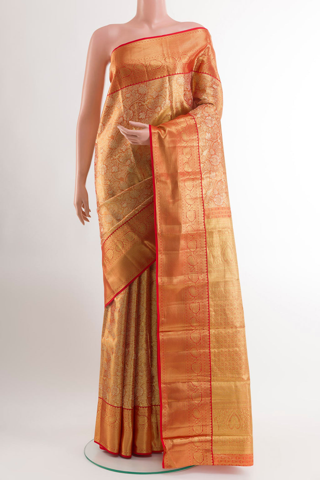 Golden Peach Kanchipuram Silk Saree with Zari Brocade on the body and Zari Border.  displayed on a mannequin
