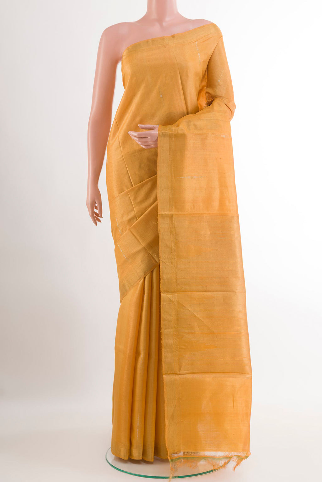 Yellow Tussar Silk Saree with Zari Butta on the body and Zari Border.  displayed on a mannequin