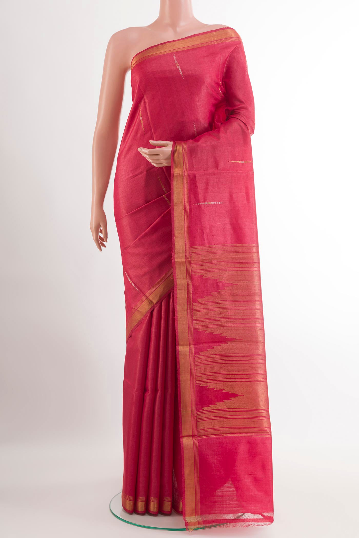 Red Tussar Silk Saree with Zari Butta on the body and Zari Border.  displayed on a mannequin