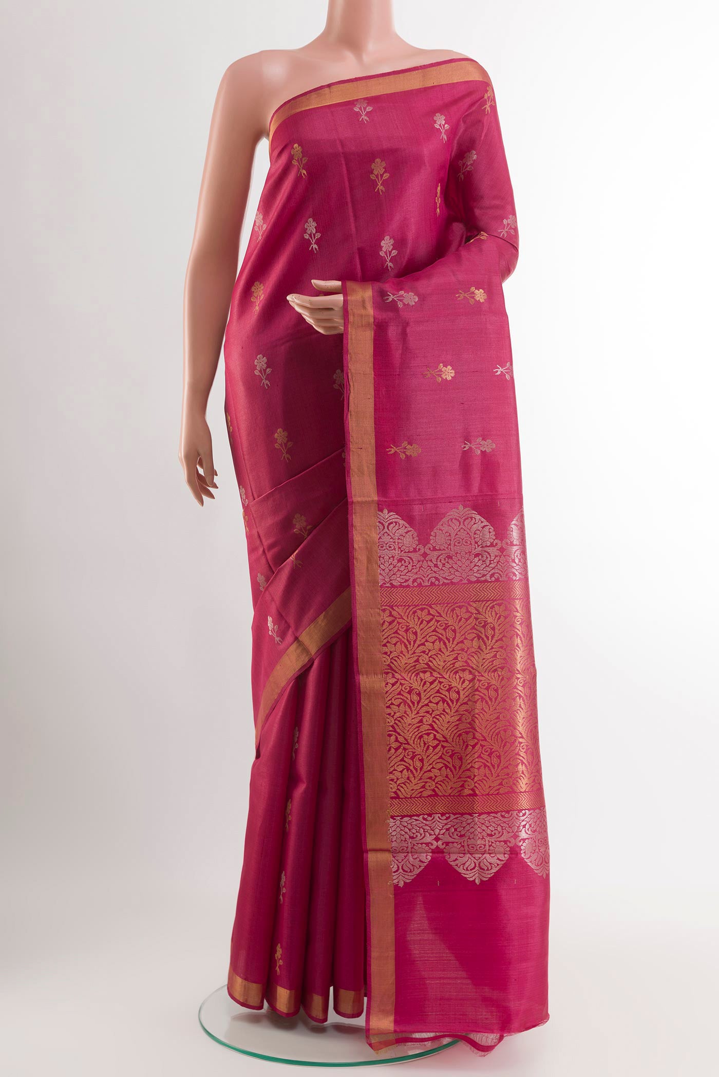 Magenta Tussar Saree with Zari Butta on the body and Zari Border.  displayed on a mannequin