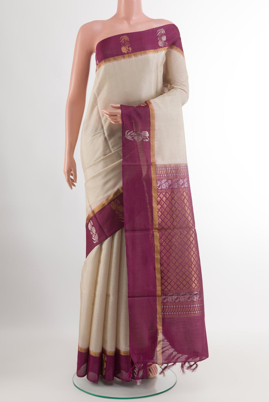 Off White Tussar Silk Saree with Plain Body and Zari Border.  displayed on a mannequin