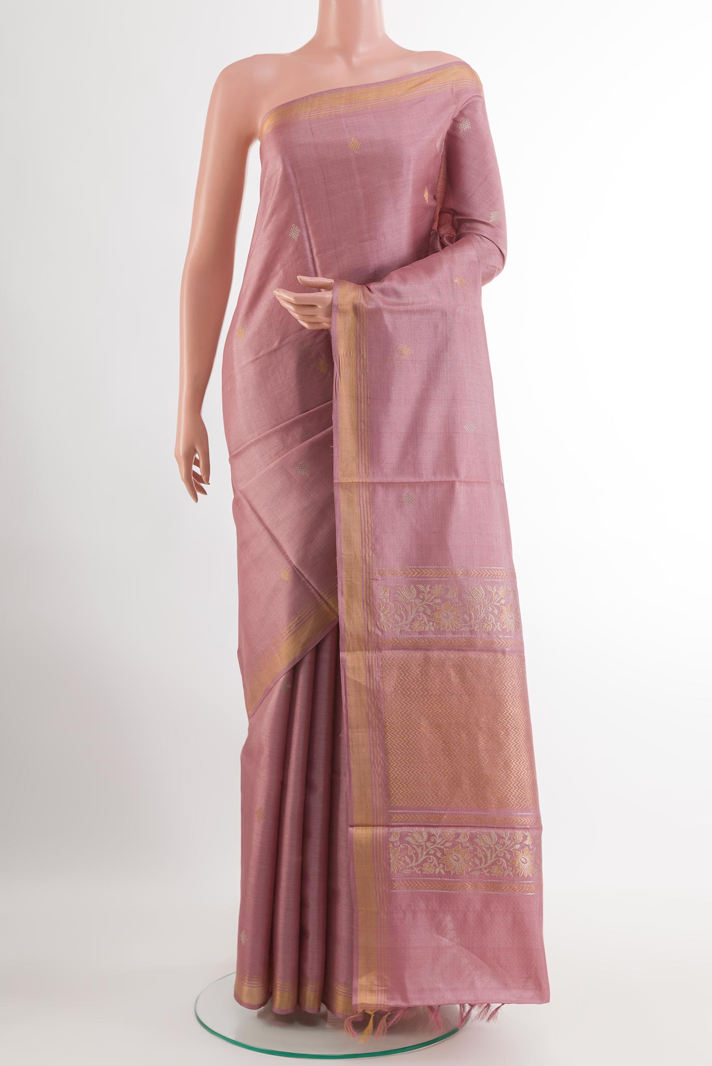 Imperial Pink Tussar Silk Saree with Zari Butta on the body and Zari Border.  displayed on a mannequin