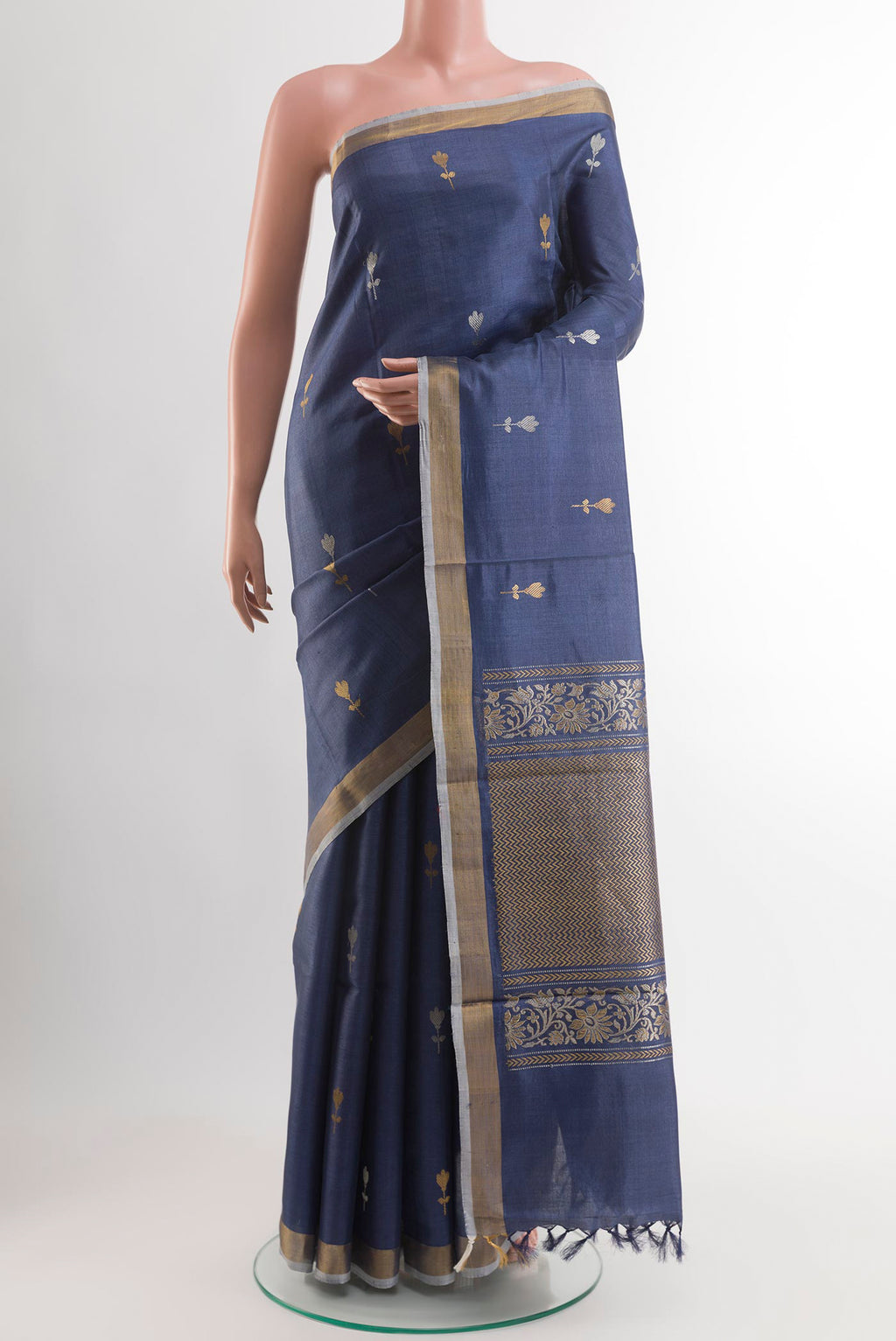 Blue Tussar Saree with Zari Butta on the body and Zari Border.  displayed on a mannequin
