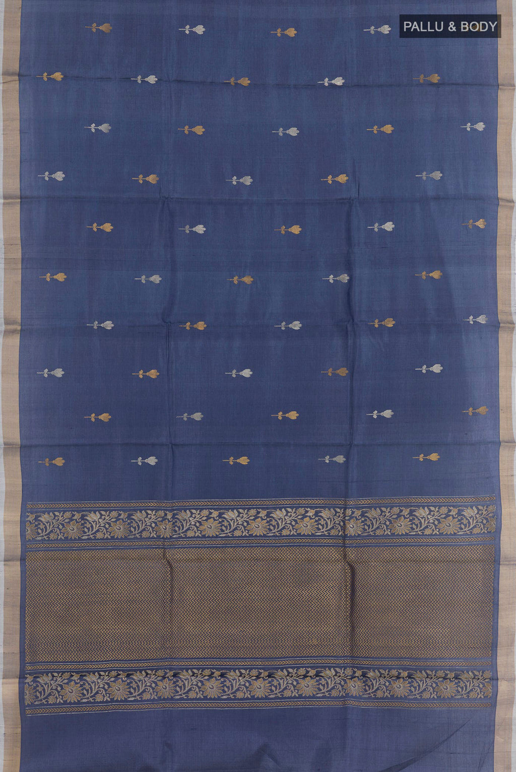 Flat view of Blue Tussar Saree with Zari Butta on the body and Zari Border. 