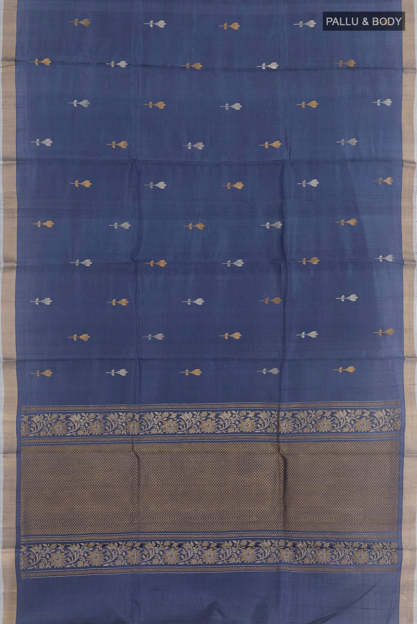 Flat view of Blue Tussar Saree with Zari Butta on the body and Zari Border. 