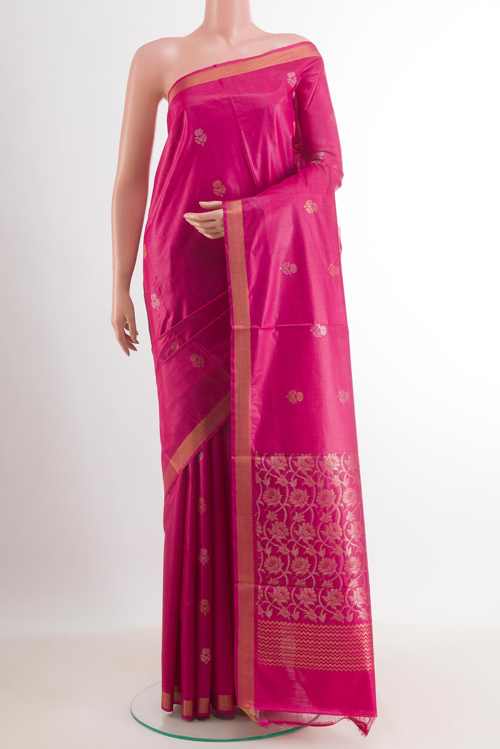 Pink Tussar Silk Saree with Zari Butta on the body and Zari Border.  displayed on a mannequin