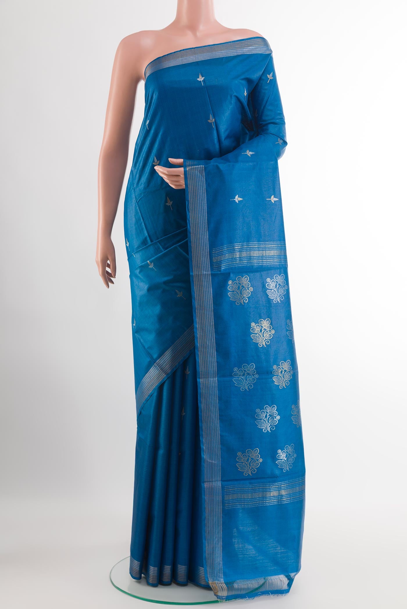 Blue Tussar Silk Saree with Zari Butta on the body and Zari Border.  displayed on a mannequin