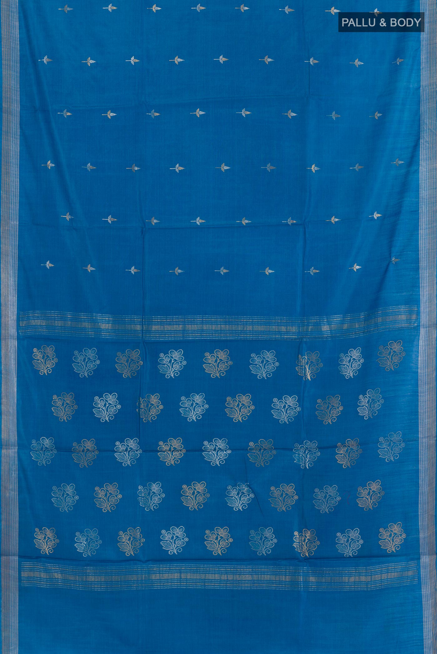 Flat view of Blue Tussar Silk Saree with Zari Butta on the body and Zari Border. 