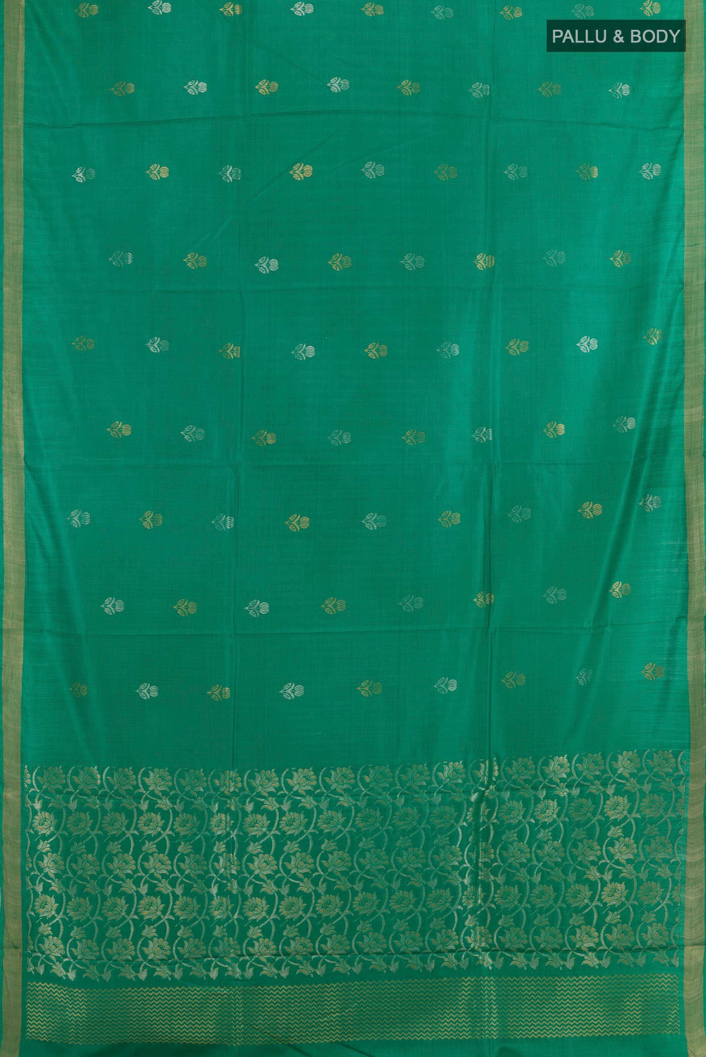 Flat view of Green Tussar Silk Saree with Zari Butta on the body and Zari Border. 