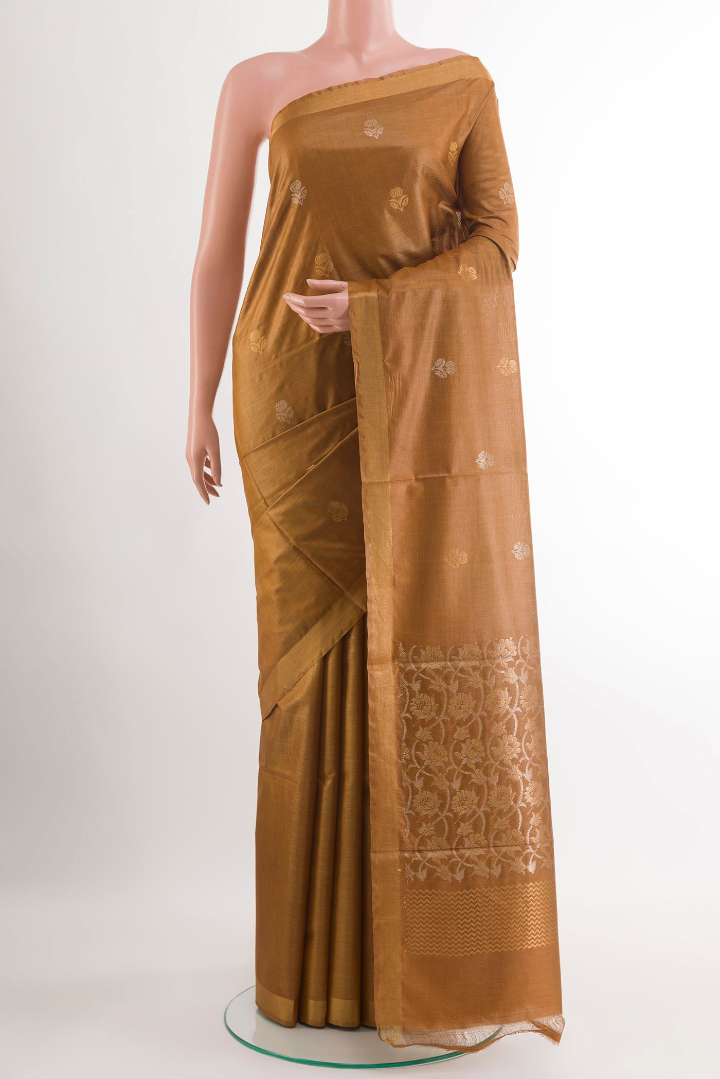 Dark Beige Tussar Silk Saree with Zari Butta on the body and Zari Border.  displayed on a mannequin