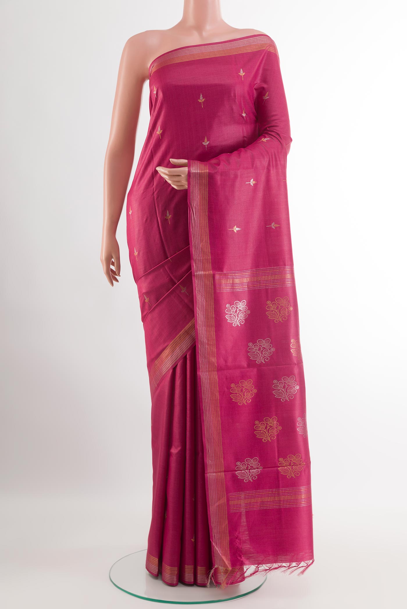 Light Magenta Tussar Silk Saree with Zari Butta on the body and Zari Border.  displayed on a mannequin