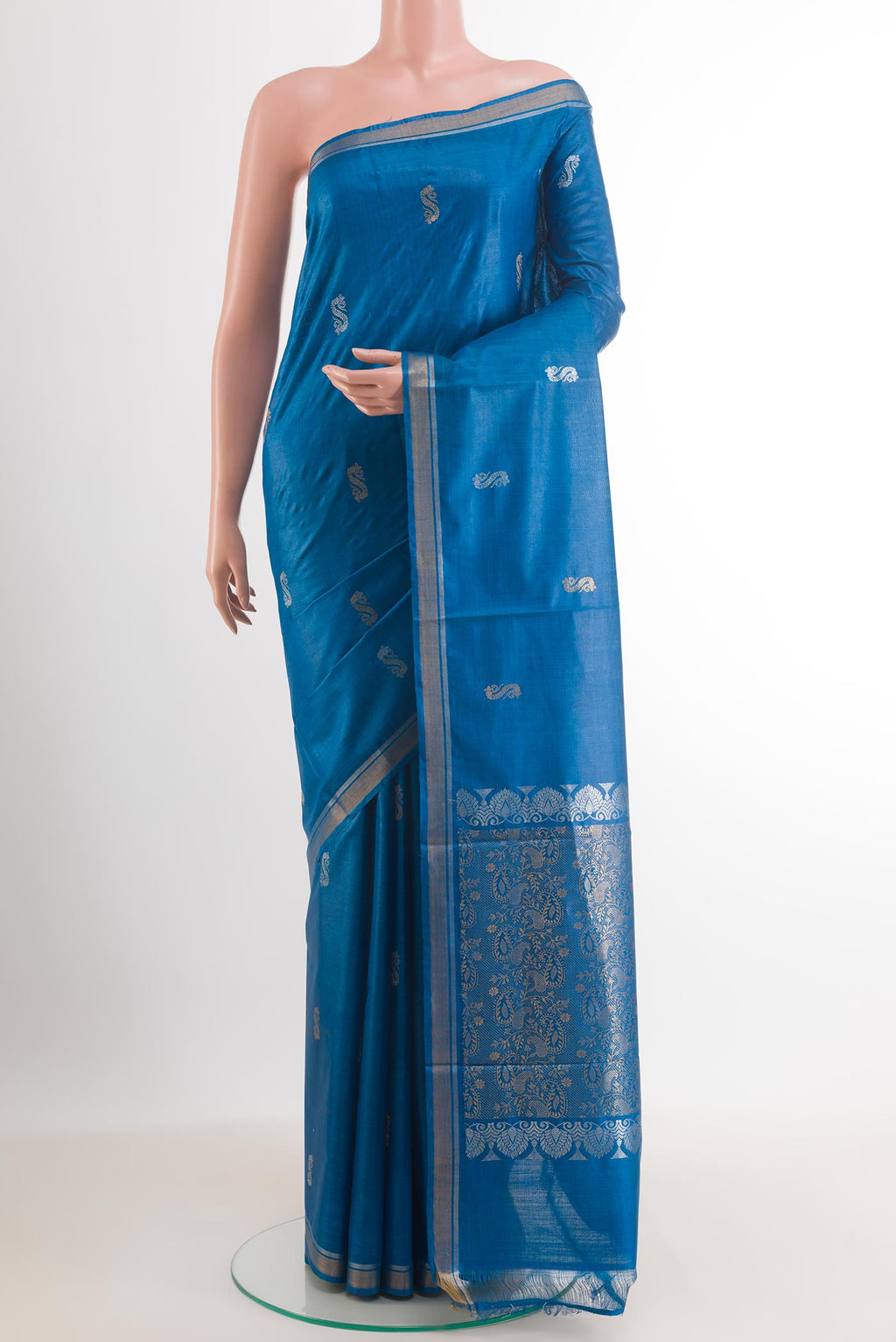 Blue Tussar Silk Saree with Zari Butta on the body and Zari Border.  displayed on a mannequin