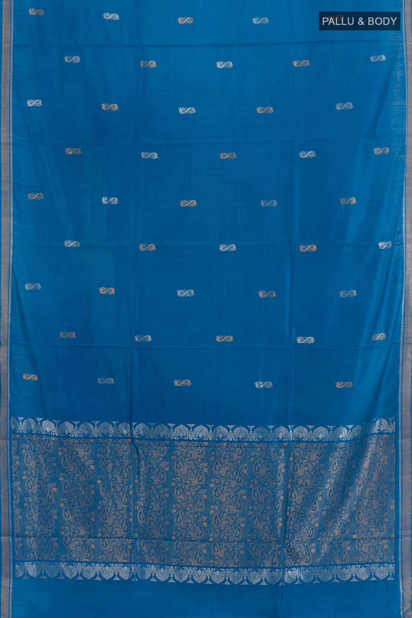 Flat view of Blue Tussar Silk Saree with Zari Butta on the body and Zari Border. 