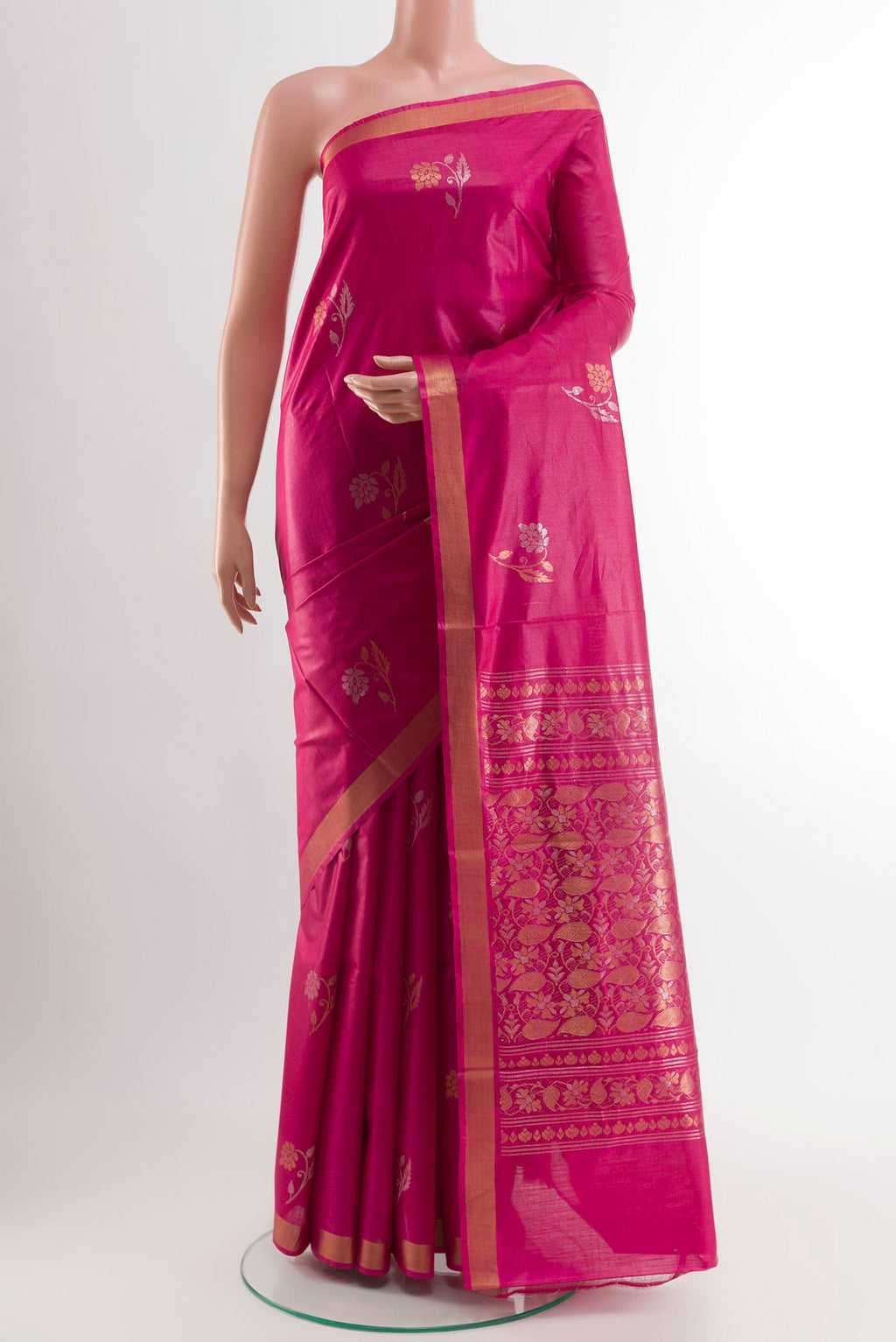 Magenta Tussar Saree with Zari Butta on the body and Zari Border.  displayed on a mannequin