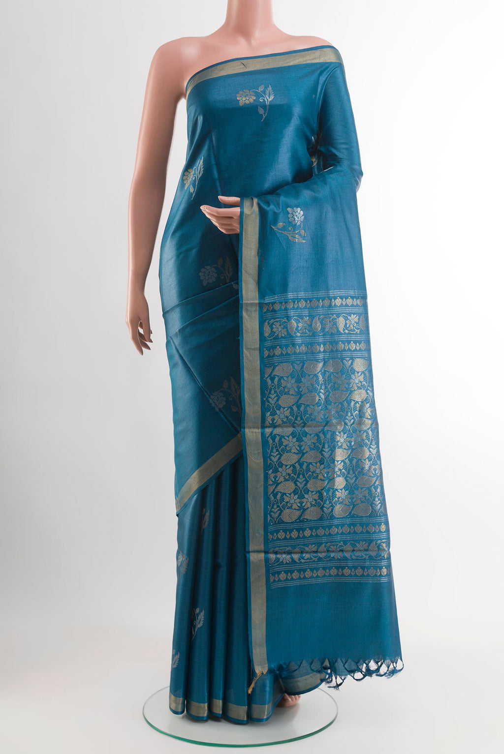 Blue Tussar Saree with Zari Butta on the body and Zari Border.  displayed on a mannequin