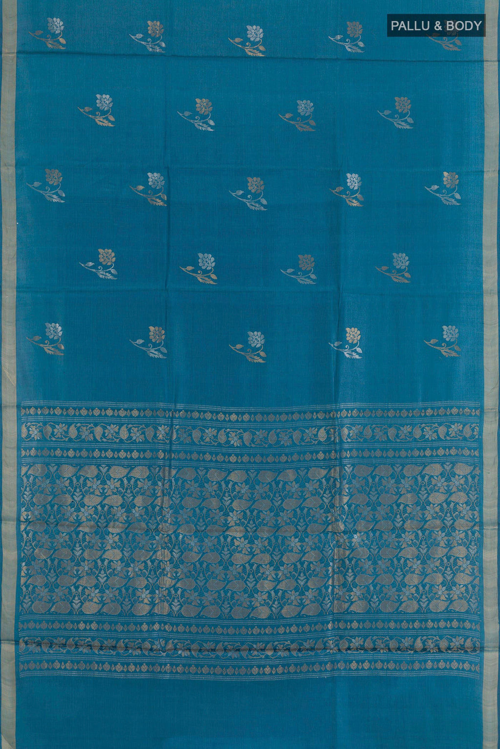 Flat view of Blue Tussar Saree with Zari Butta on the body and Zari Border. 
