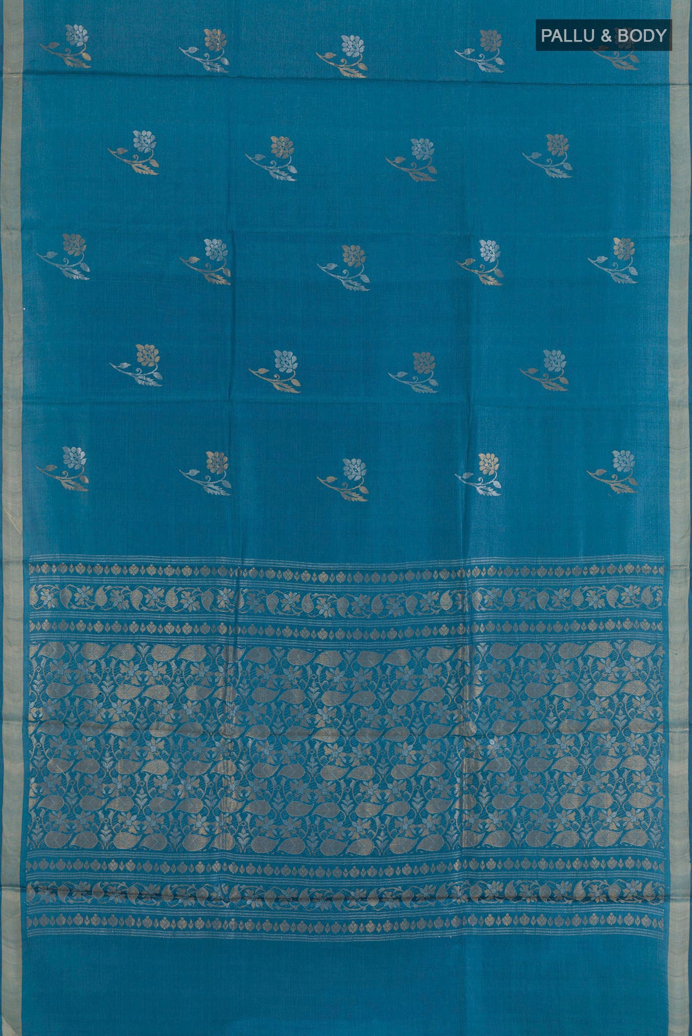 Flat view of Blue Tussar Saree with Zari Butta on the body and Zari Border. 