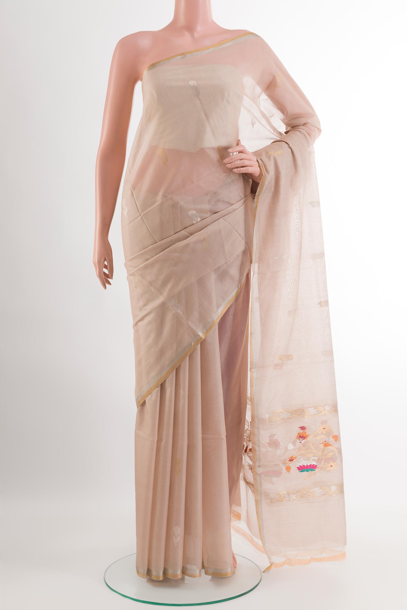 Cream Tussar Silk Saree with Zari Butta on the body and Zari Border.  displayed on a mannequin