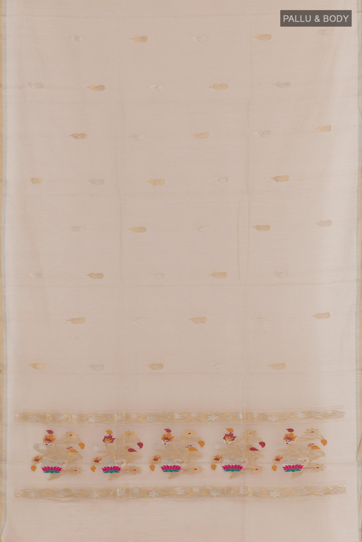 Flat view of Cream Tussar Silk Saree with Zari Butta on the body and Zari Border. 