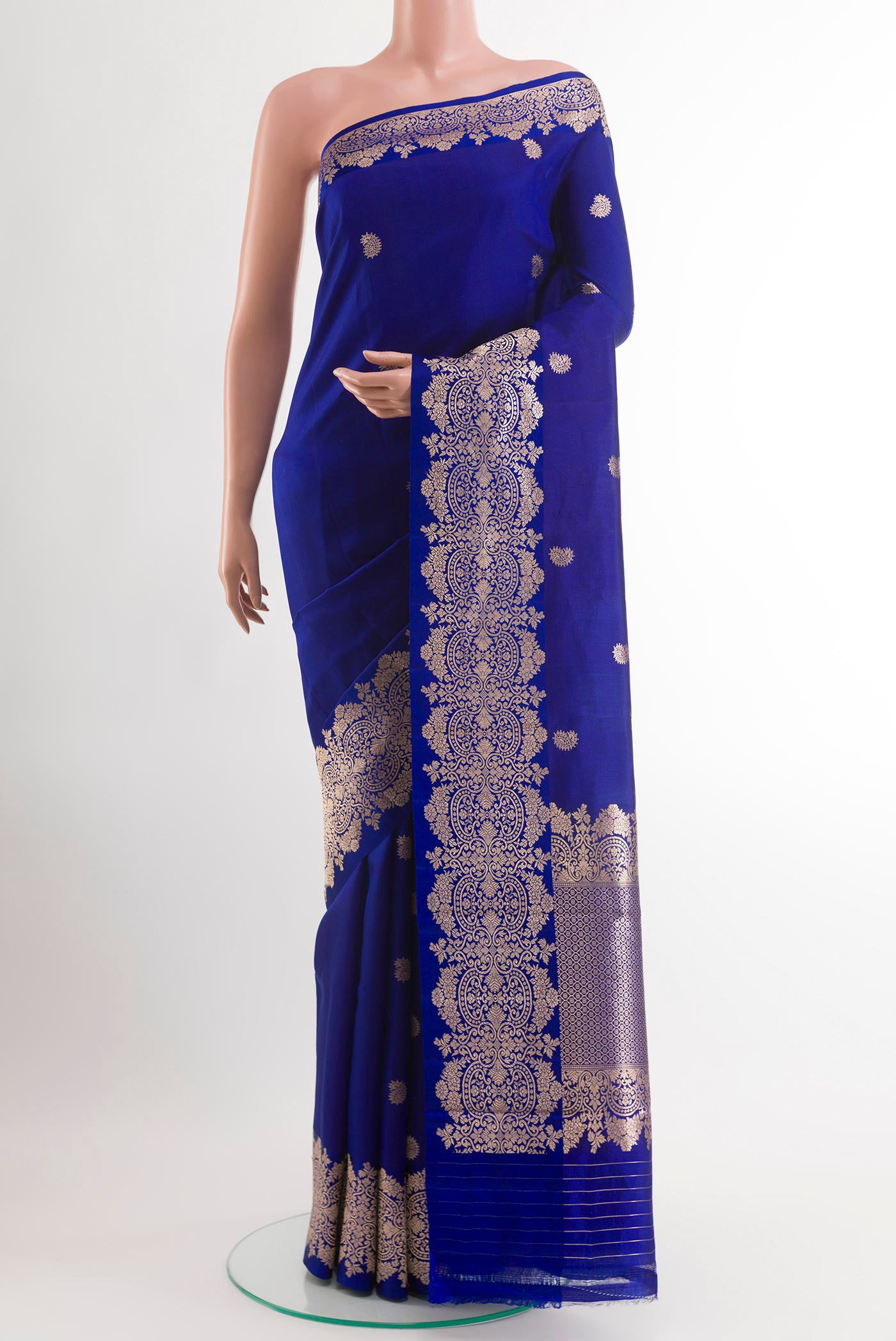 Blue Banarasi Katan Silk Saree with Zari Butta on the body and Zari Border.  displayed on a mannequin