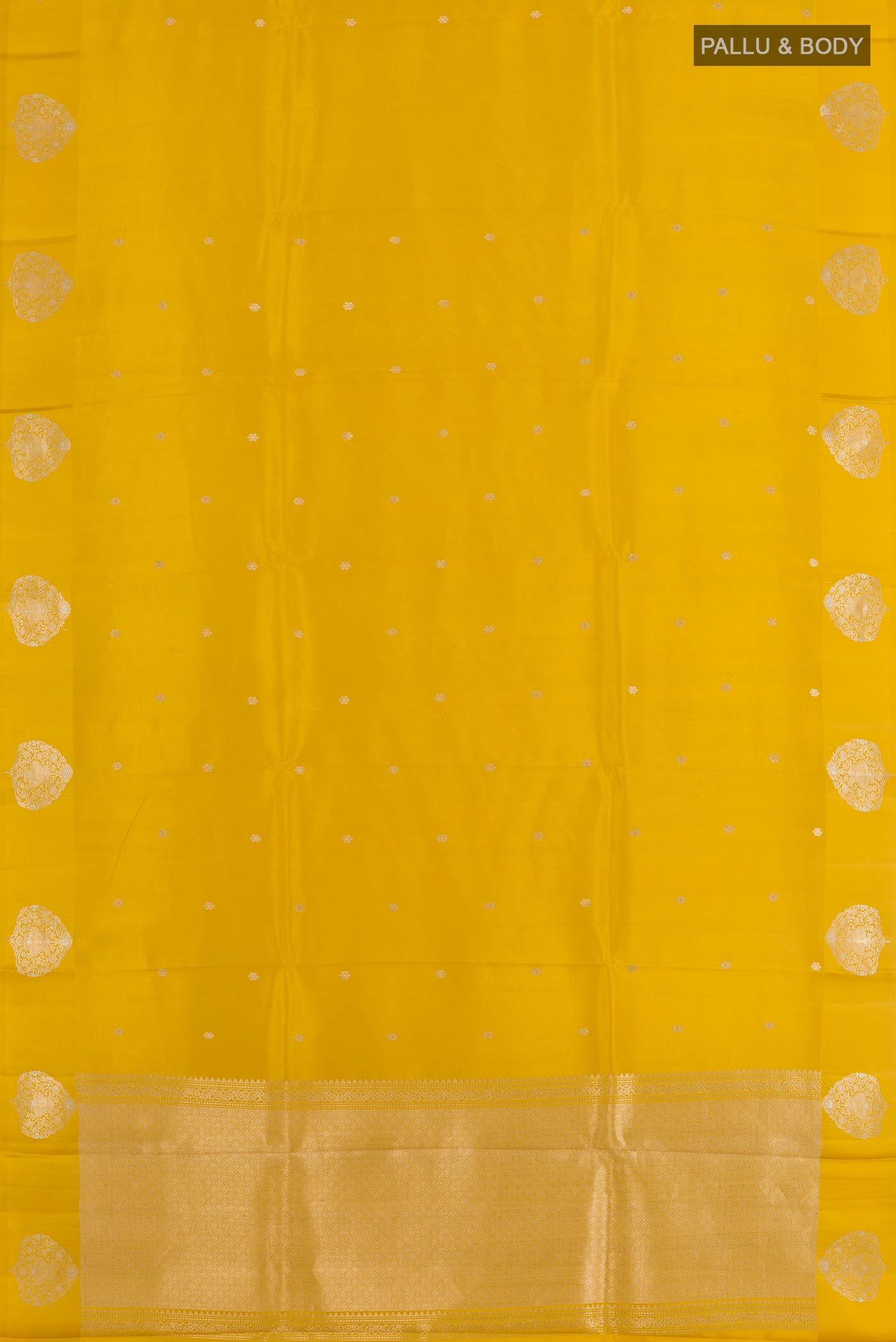 Flat view of Yellow Tussar Silk Saree with Zari Butta on the body and Zari Border. 