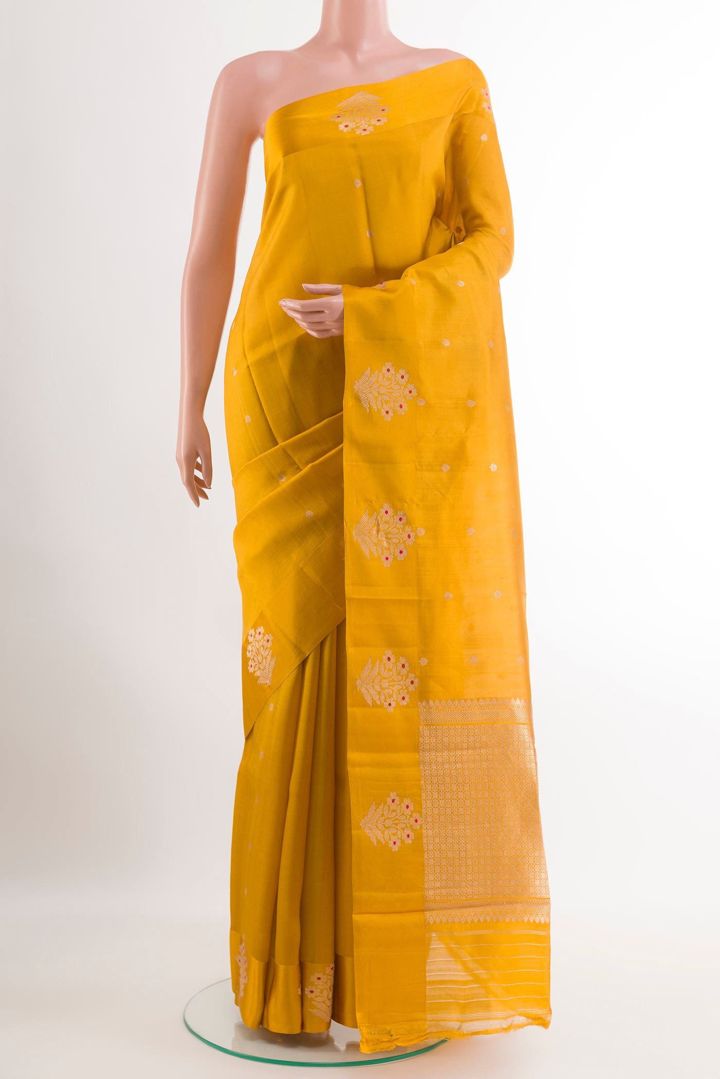 Yellow Banarasi Katan Silk Saree with Zari Butta on the body and Zari Border.  displayed on a mannequin