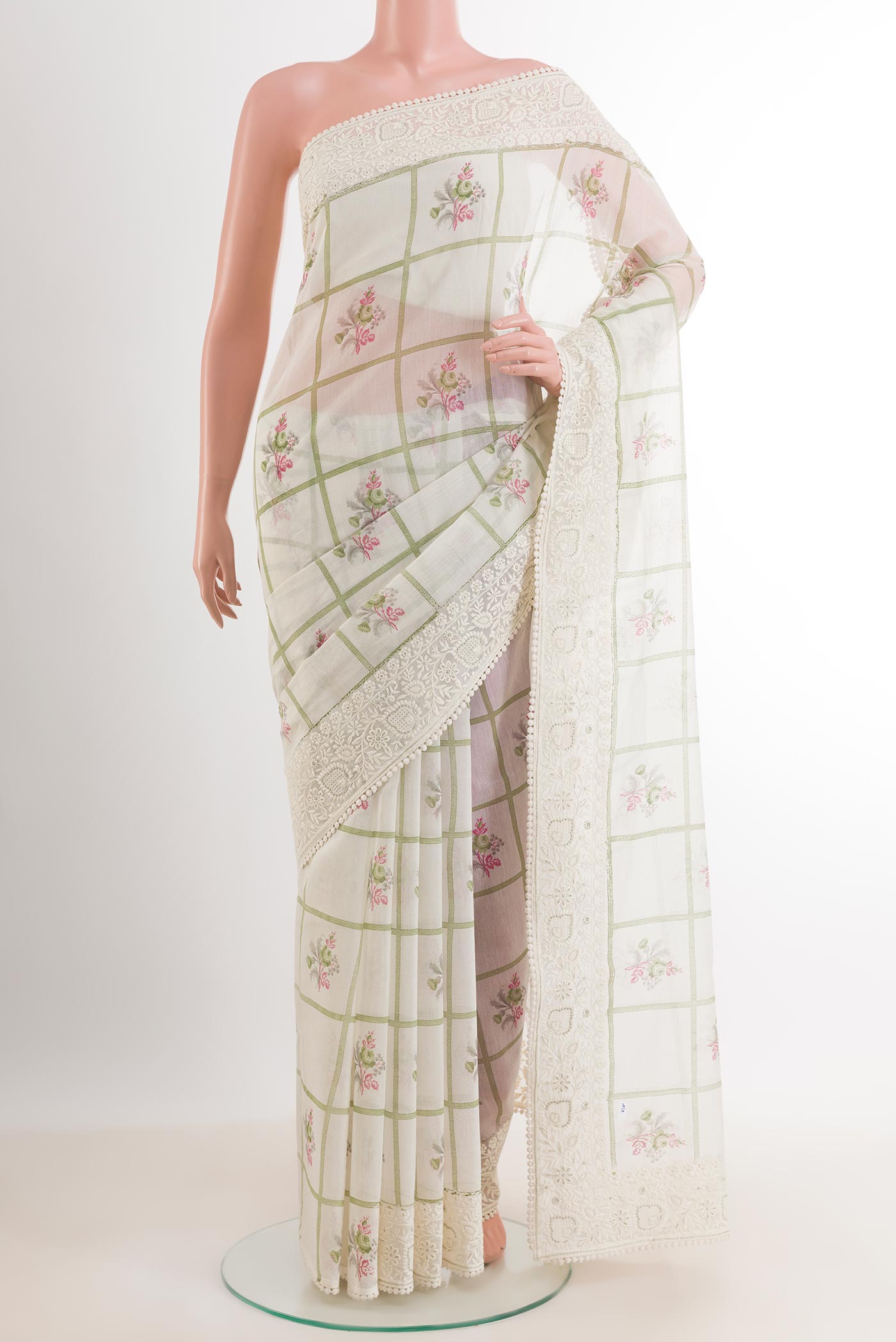White Chanderi Silk Cotton Saree with Printed design on the body and Embroidery Border.  displayed on a mannequin