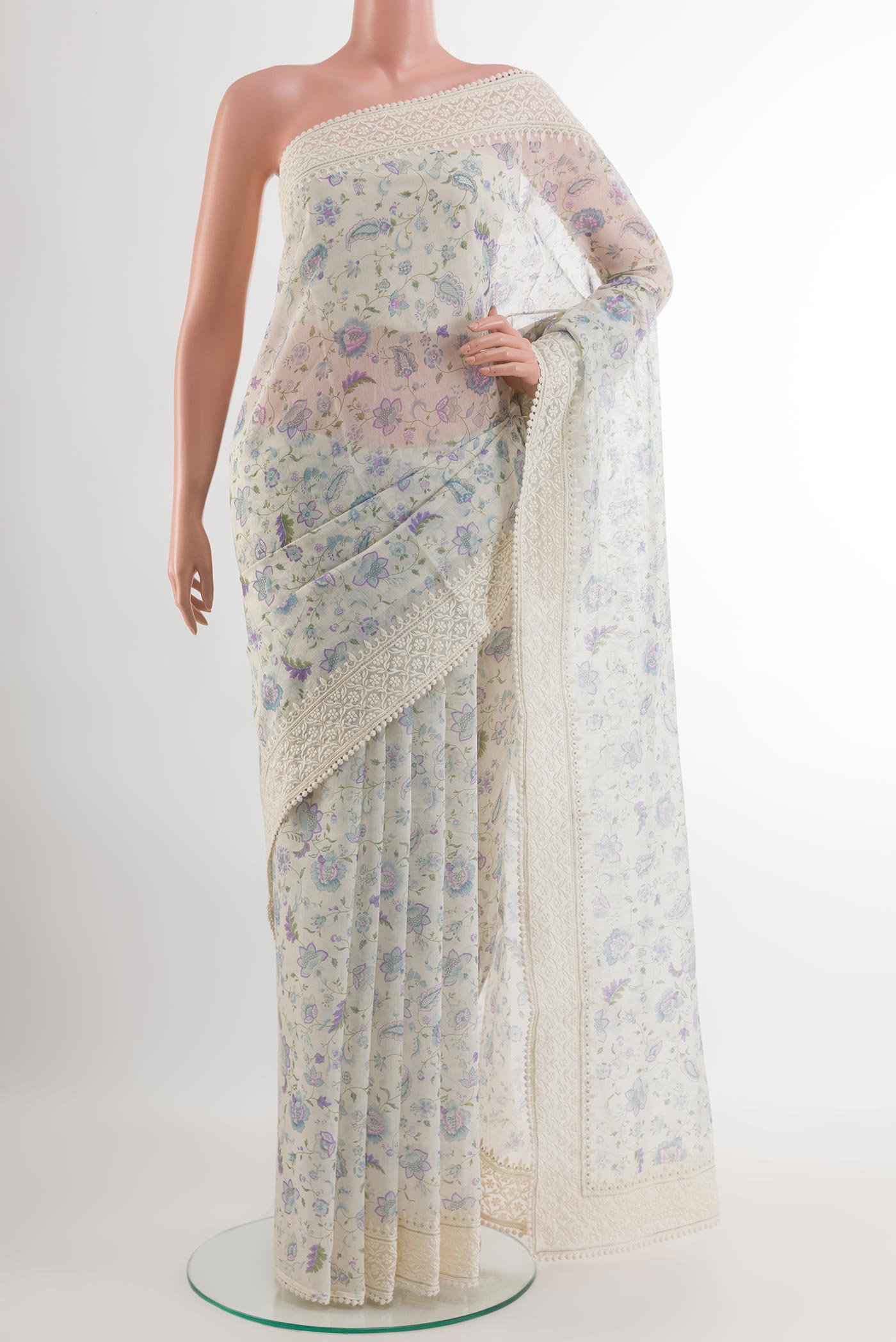Off White Blended Chanderi Silk Cotton Saree with Printed design on the body and Embroidery Border.  displayed on a mannequin