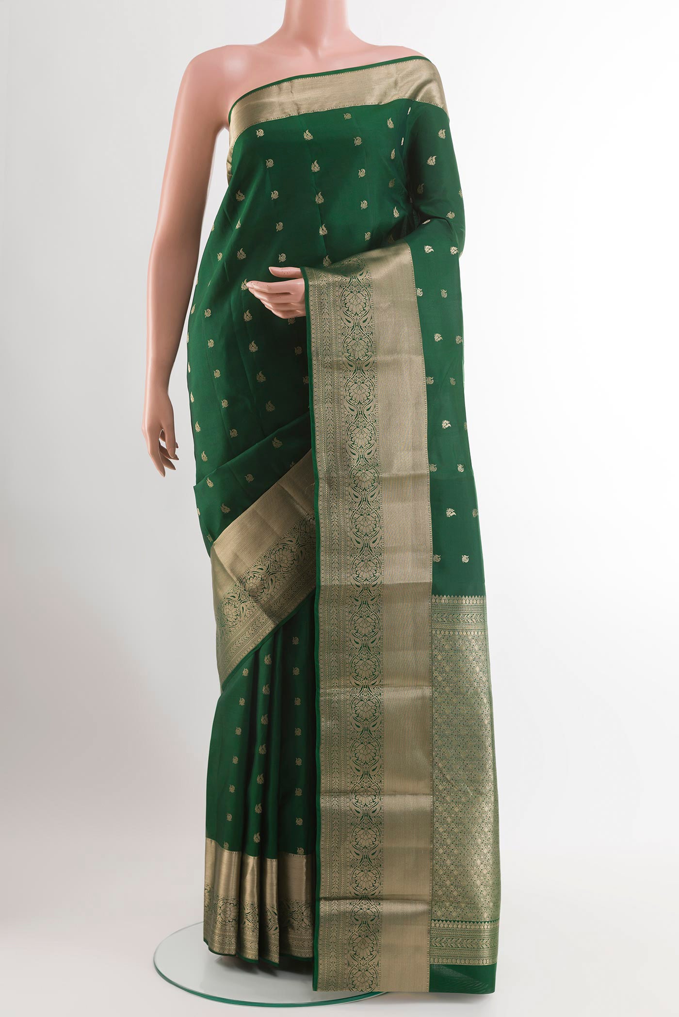 Green Dual Tone Kanchipuram Silk Saree with Zari Butta on the body and Zari Border.  displayed on a mannequin