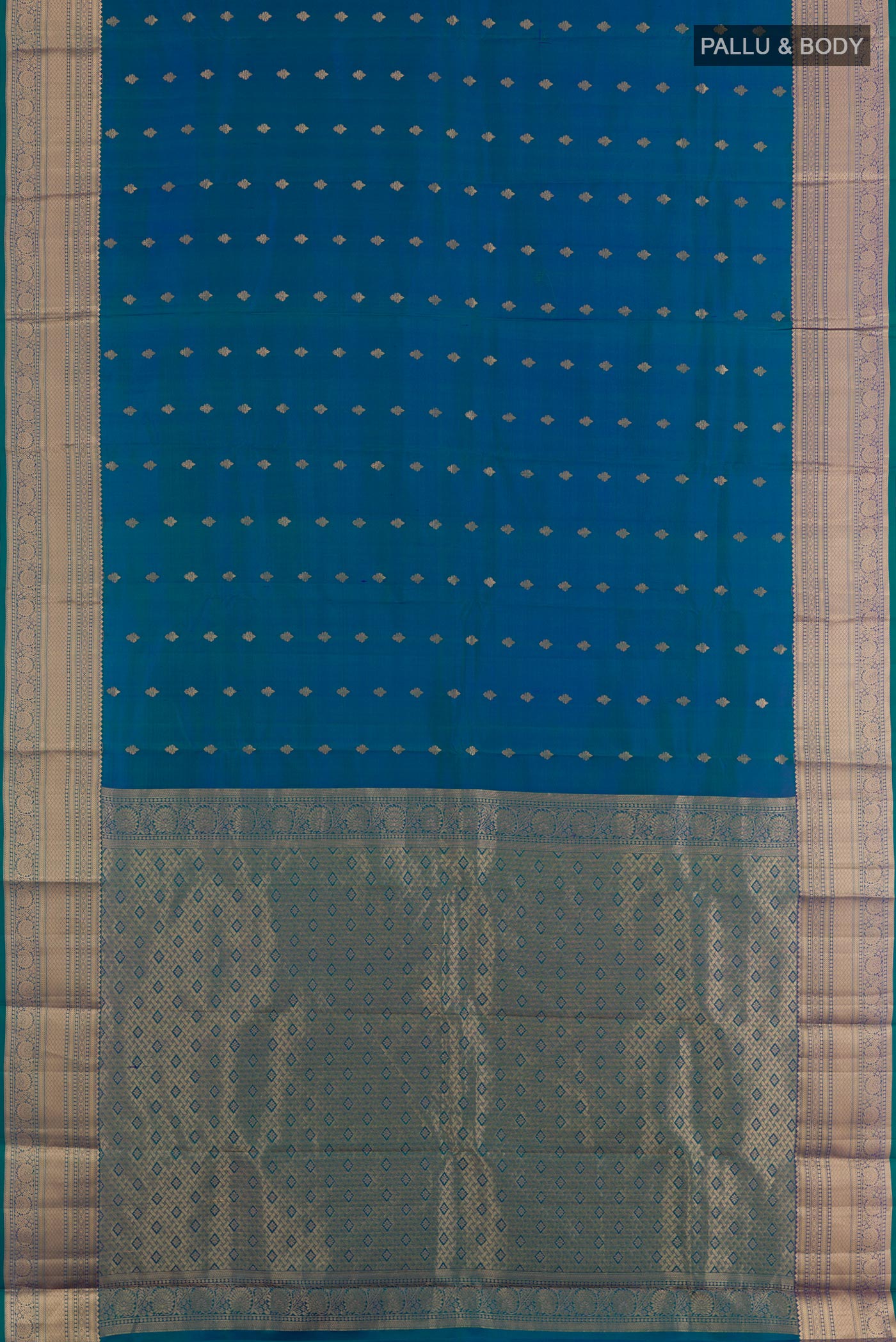 Flat view of Peacock Blue Kanchipuram Silk Saree with Zari Butta on the body and Zari Border. 