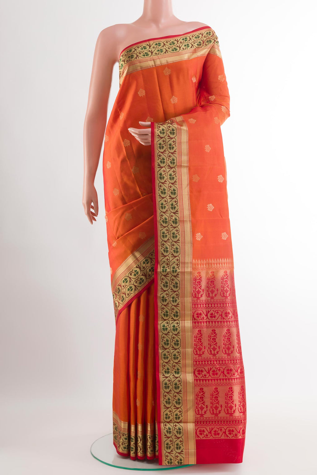 Orange Kanchipuram Silk Saree with Zari Butta on the body and Paithani Border.  displayed on a mannequin