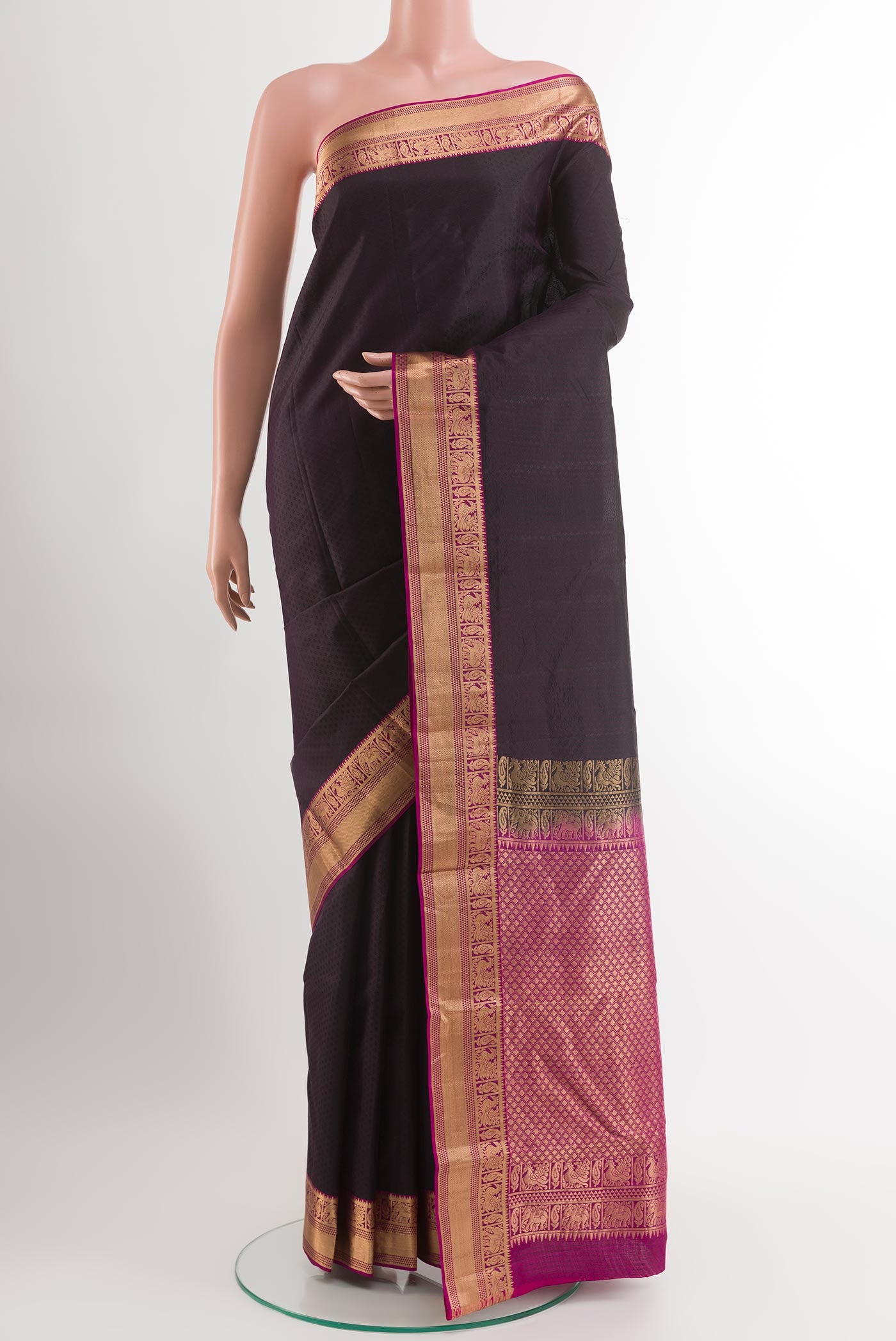 Black Kanjivaram Silk Saree with Jacquard design on the body and Zari Border.  displayed on a mannequin