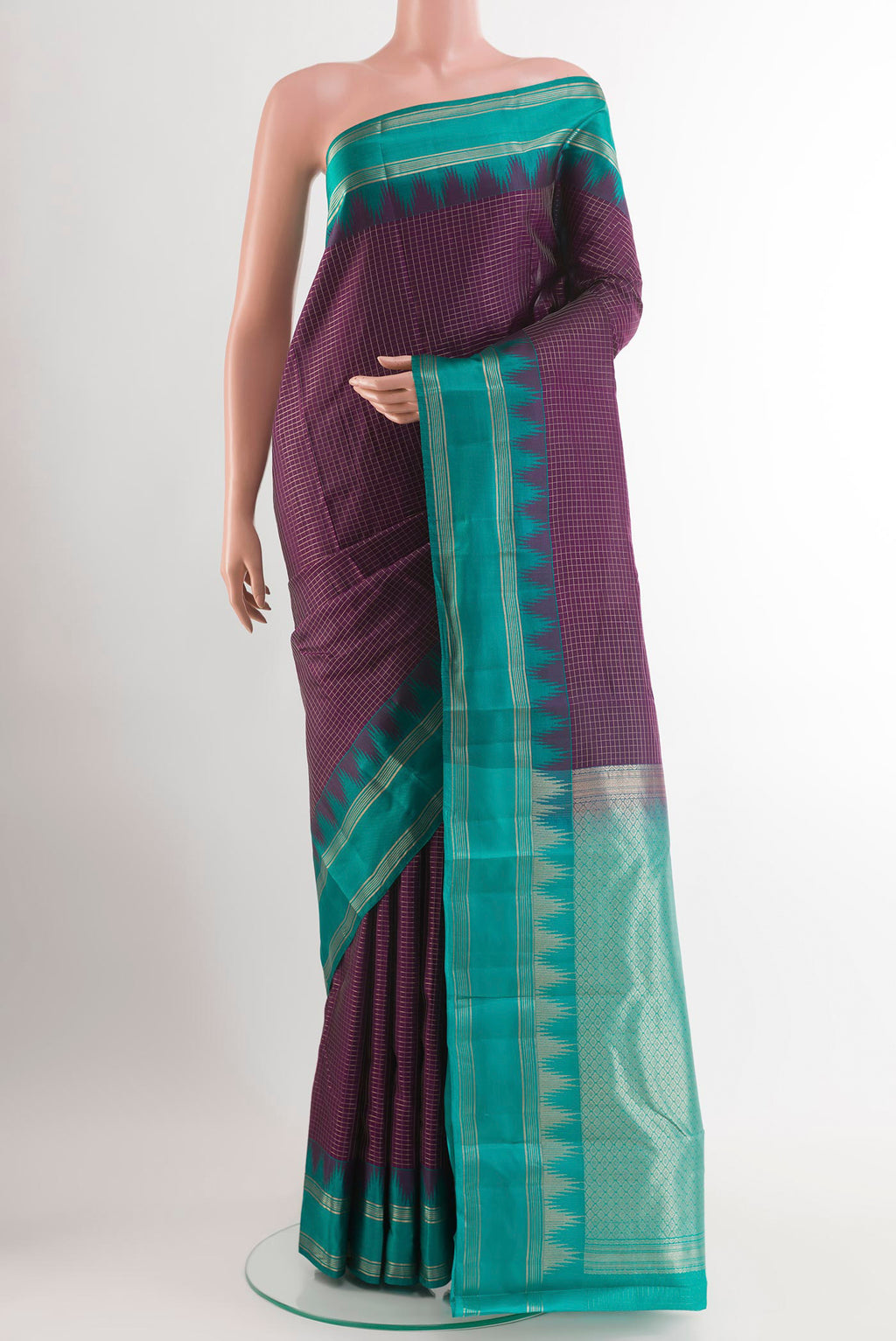 Purple Kanchipuram Silk Saree with Checked design on the body and Zari Border.  displayed on a mannequin