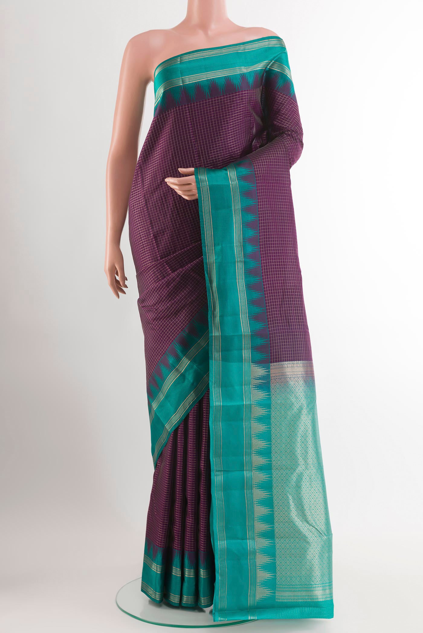 Purple Kanchipuram Silk Saree with Checked design on the body and Zari Border.  displayed on a mannequin