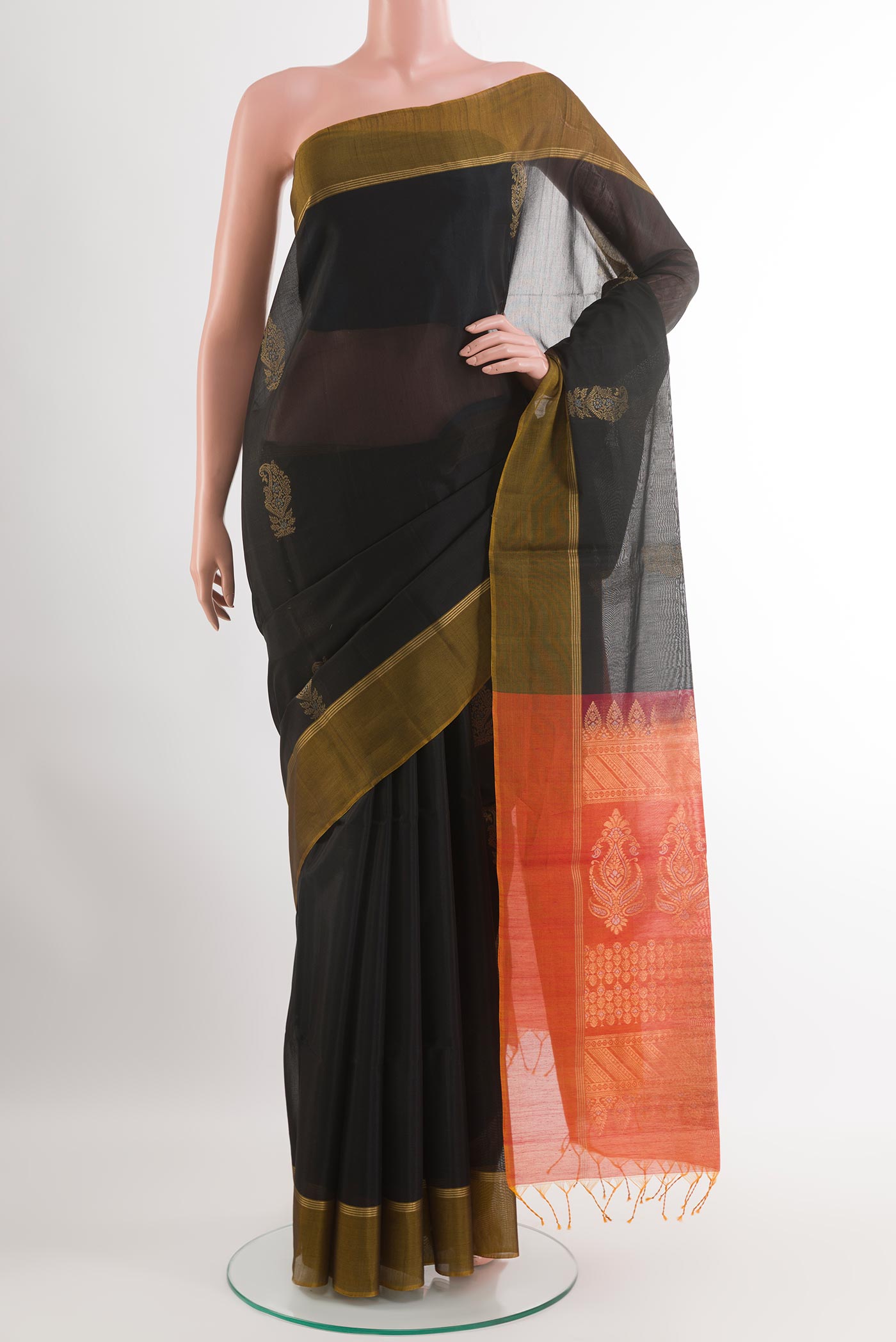 Black Blended Kora Cotton Saree with Zari Butta on the body and Zari Border.  displayed on a mannequin