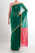 Green Blended Kora Cotton Saree with Zari Butta on the body and Zari Border.  displayed on a mannequin