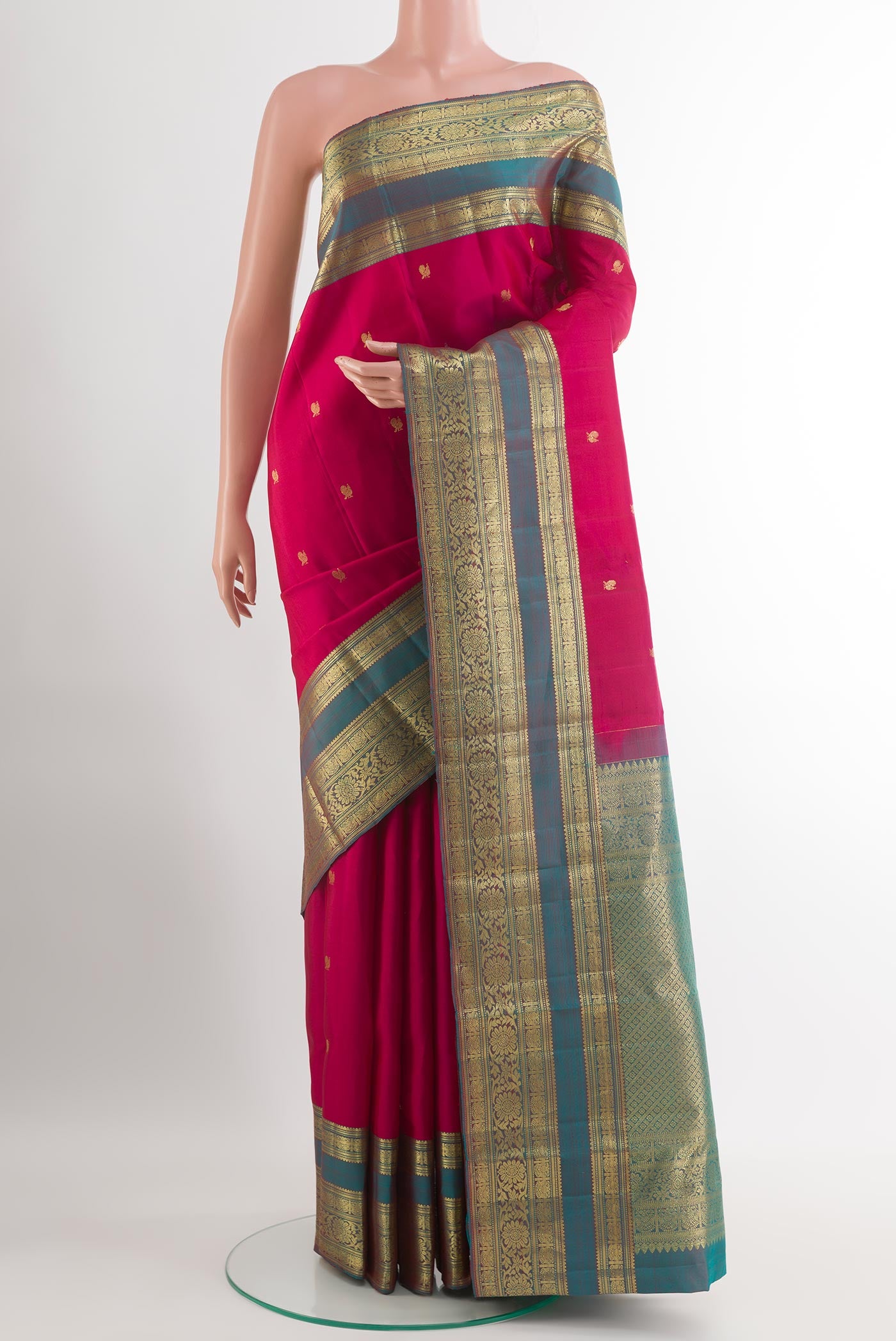 Maroon Kanchipuram Silk Saree with Zari Brocade on the body and Zari Border.  displayed on a mannequin