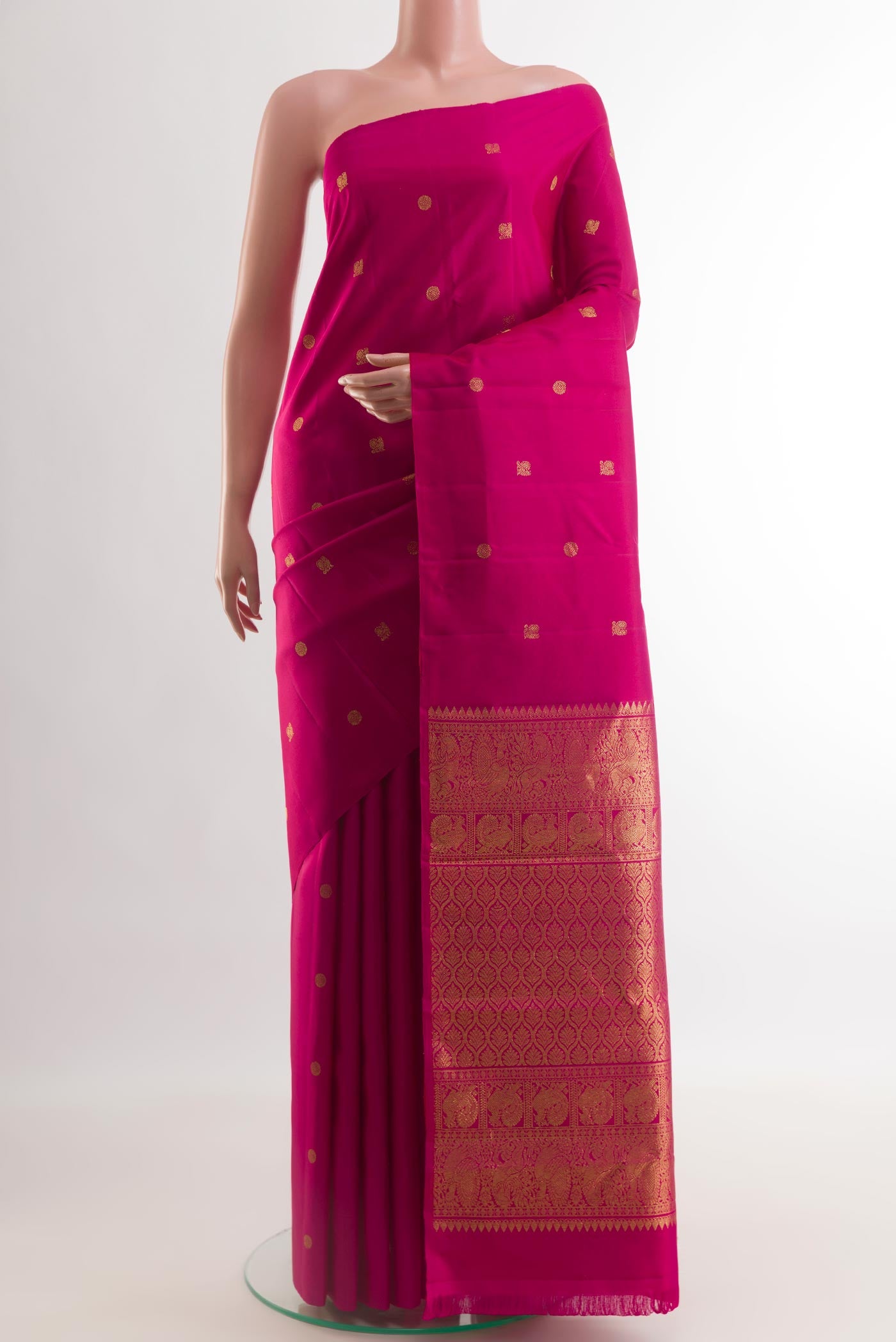 Pink Kanchipuram Silk Saree with Zari Butta on the body and Without Border.  displayed on a mannequin