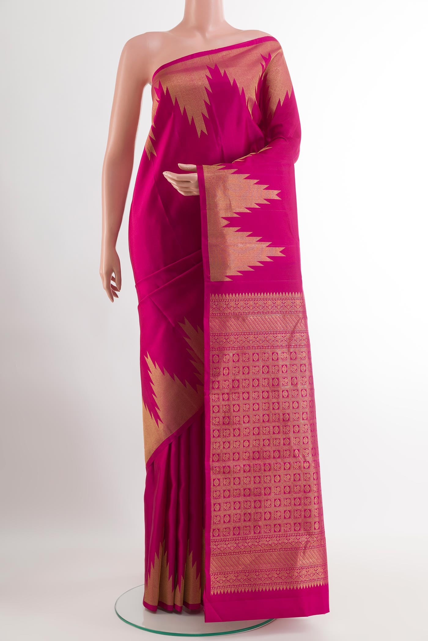 Rani Pink Kanchipuram Silk Saree with Plain Body and Zari Border.  displayed on a mannequin