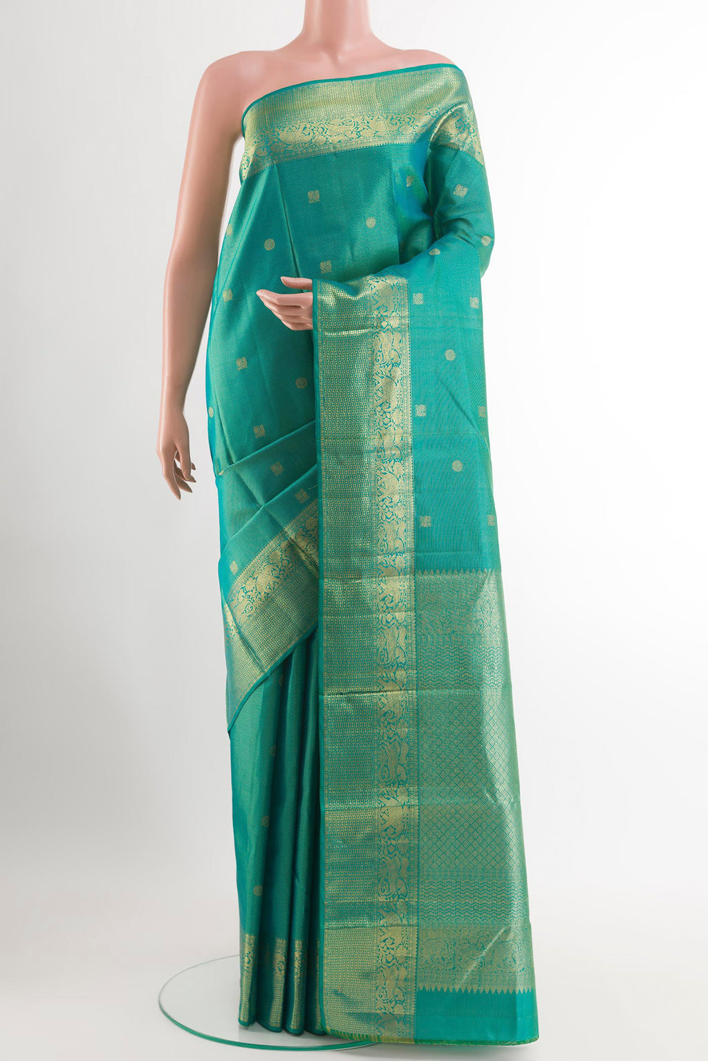 Sea Green Kanjivaram Silk Saree with Zari Brocade on the body and Zari Border.  displayed on a mannequin